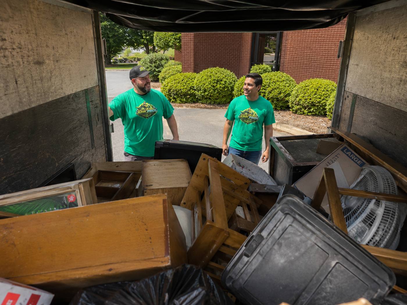 North Georgia Junk Pros junk removal crew loading a truck